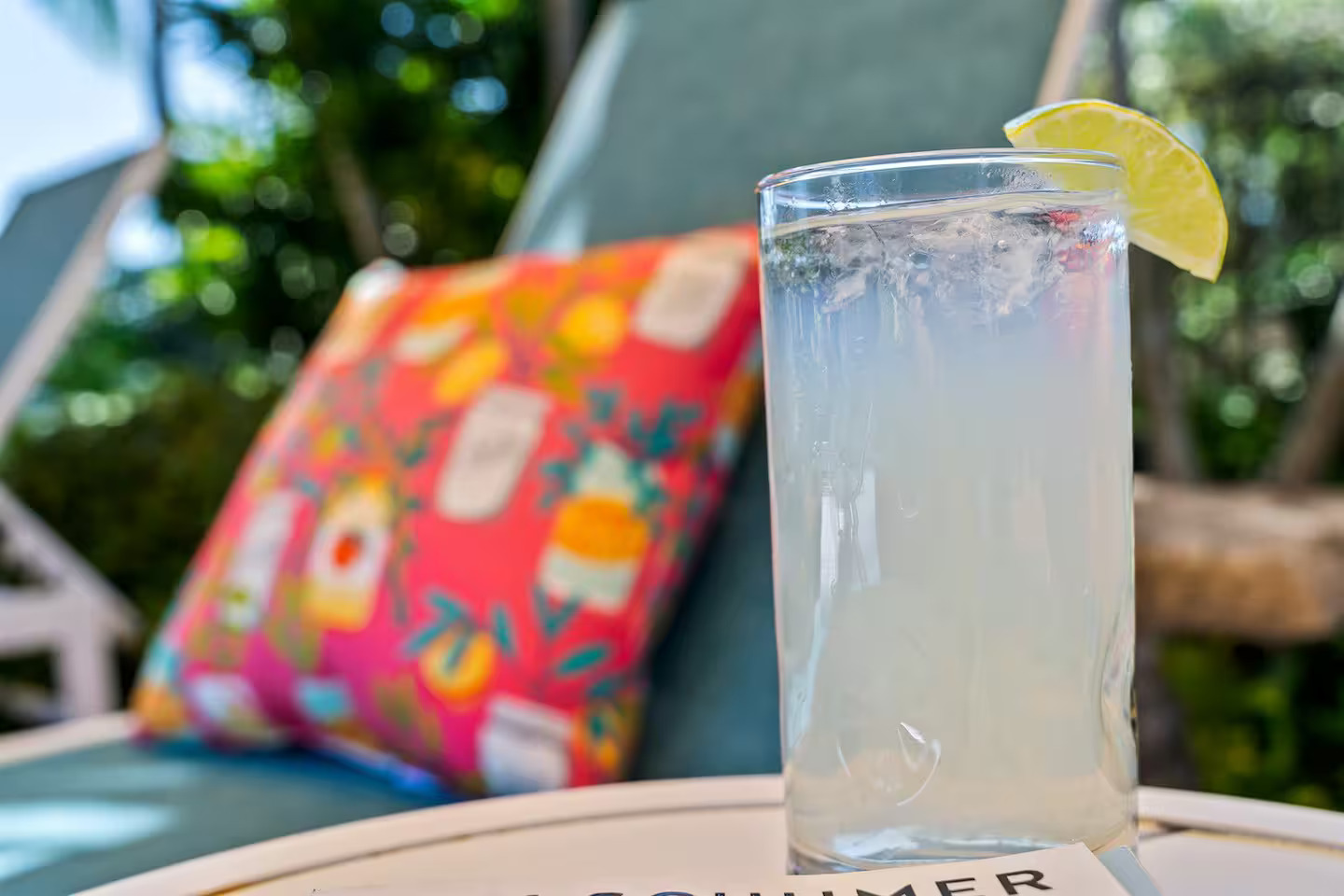 Icy lemonade poolside with colorful cushions at luxury Pompano Beach vacation rental